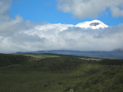 Cotopaxi peeking above the clouds.