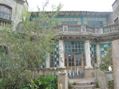 Crazy old house on the side of the road.