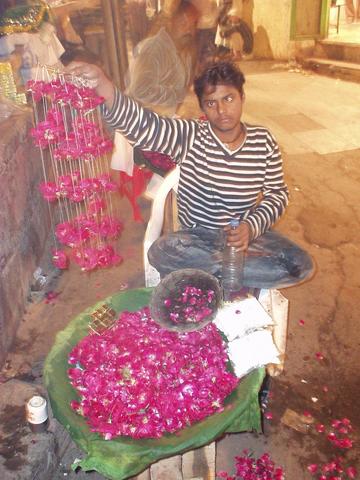 Boy selling rose petals for those asking for Nizam-ud-din's favor.