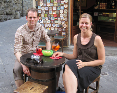 Joe and Suzanne drinking Aperol spritzes in Arezzo, Italy.  Living the cafe lifestyle is a good way to recover after a long day of biking.
