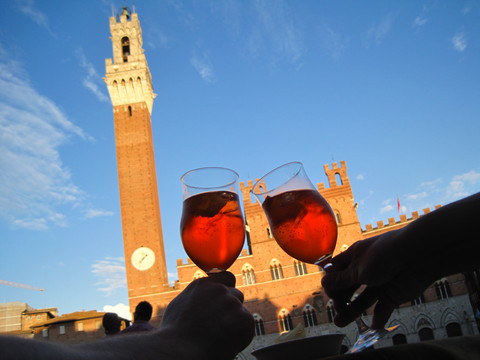 Relaxing in the central plaza of Siena with Aperol spritzes.