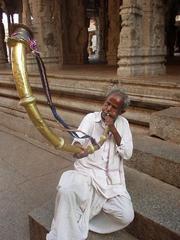 Man blowing his kompu in the Virupaksha temple.