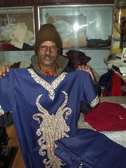 Jaipaul the tailor, holding Mom's salwar.