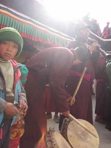 Men playing drums and tibetan horn at the 2003 Spituk Festival.