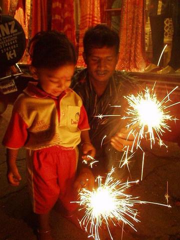 Boy with sparklers for Diwali.