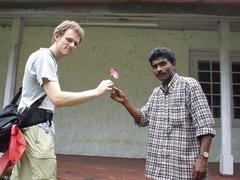 Rajan, the Assistant Manager's cook, hands me a flower.