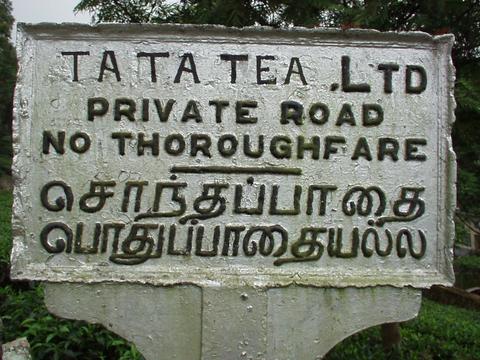 Sign for a road owned by the stuttering Tata Tea Corporation.
