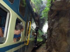 Herve looking out of the window of the miniature steam train to Ooty.