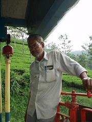 The brakeman on the last car of the Ooty train, on the way down.