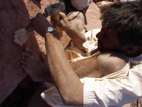 Man carving the head of a figure for a Jain temple in Osiyan, Rajasthan.