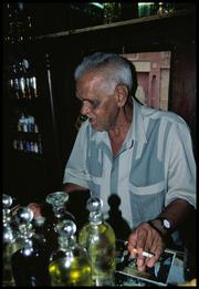 Suleyman with the Pyrex bottles of essential oils.