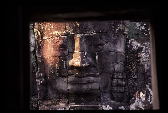 Statue of Avalokitesvara, the Bayon, ruins of Angkor. Avalokitesvara is a Buddhist deity who has postponed his own Buddhahood in order to be on the watch for the problems of people in distress, and to help all people reach enlightenment. 