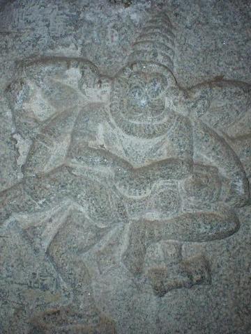 Vishnu, as Narasimha, gobbling the evil king Hiranyakashipu's entrails.