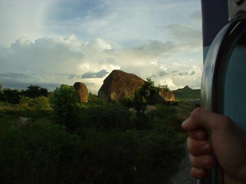 White-knuckled grip on the rail, looking at big rocky formations in A.P.