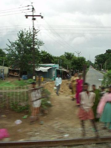 Passing a village on the train.